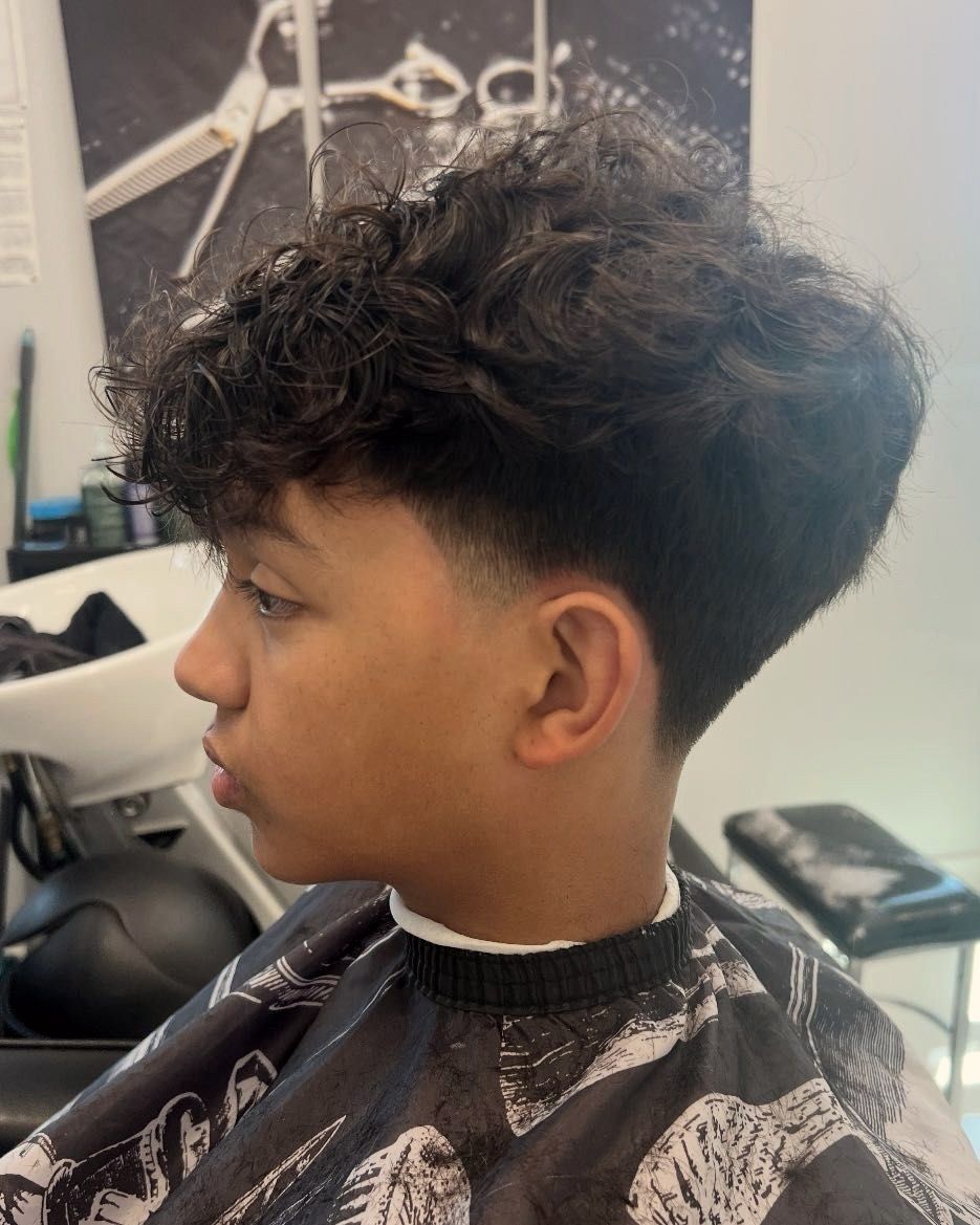 Curly top with a taper on a teen client